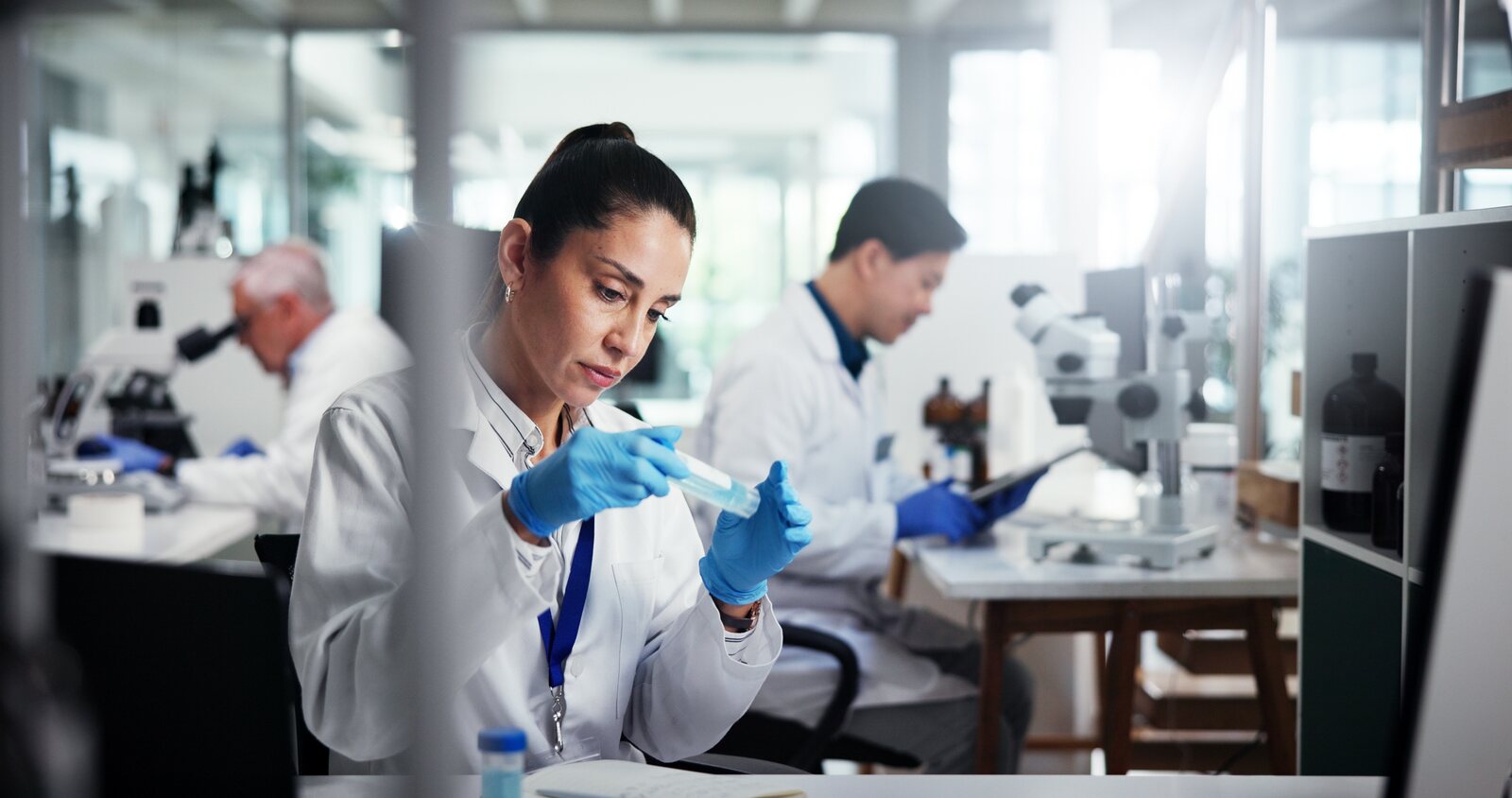 A lab scientist analyzing a sample