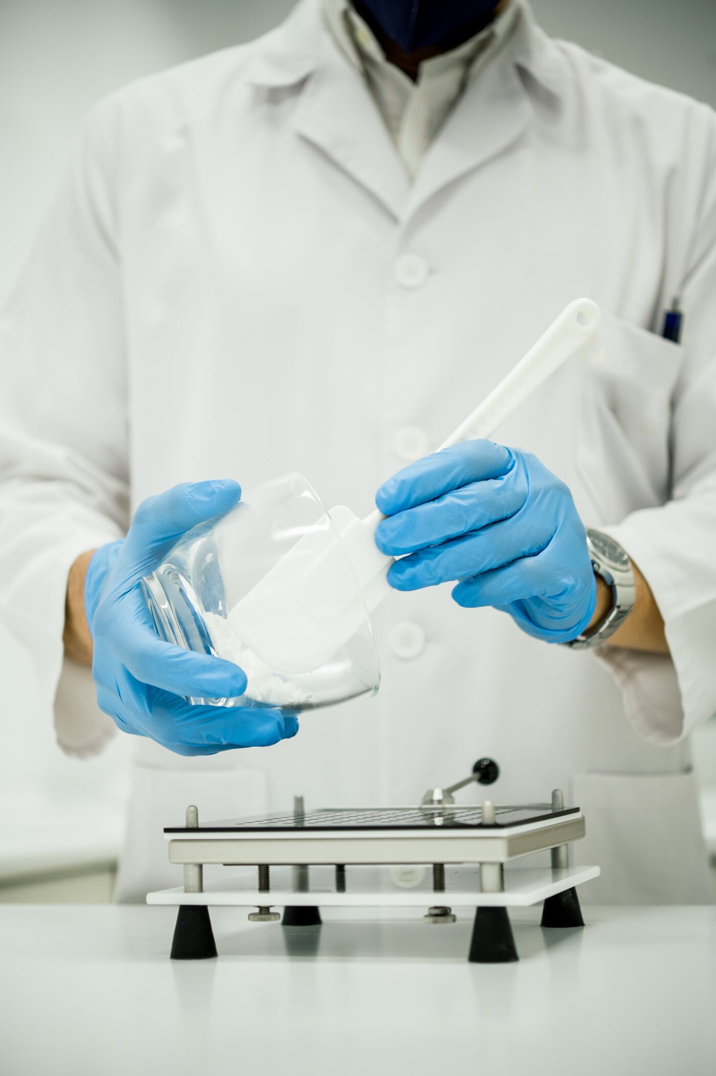 A Syed pharmacist preparing a compounded medication